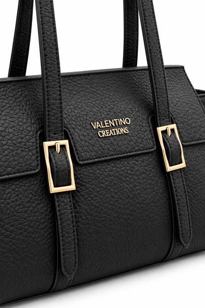 Dettaglio fibbie dorate e texture della Borsa Valentino Creations Noir Élégance